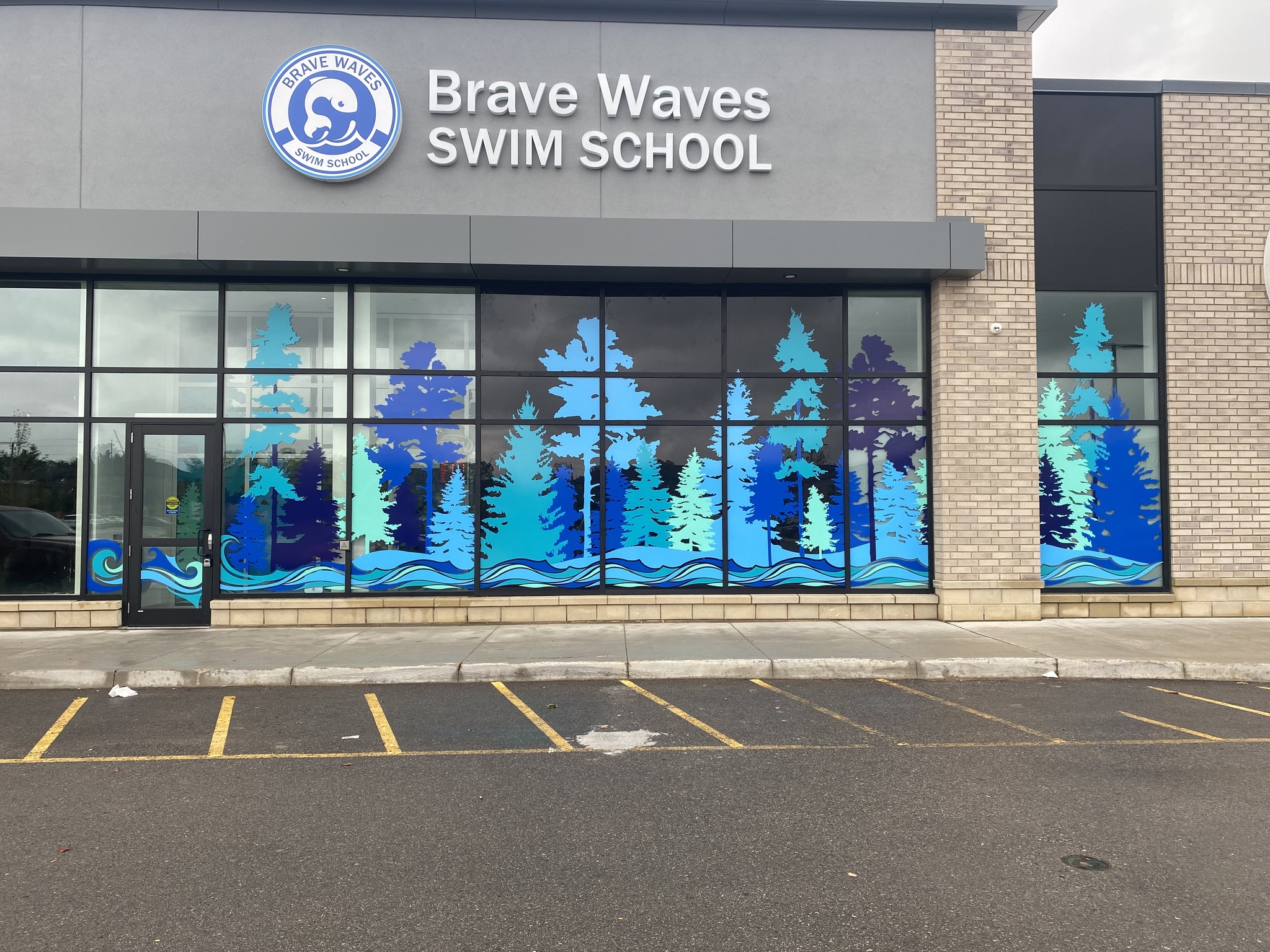 Storefront window graphics used to advertise business offers