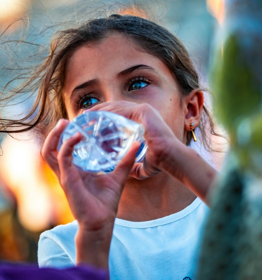 Person drinking water at event